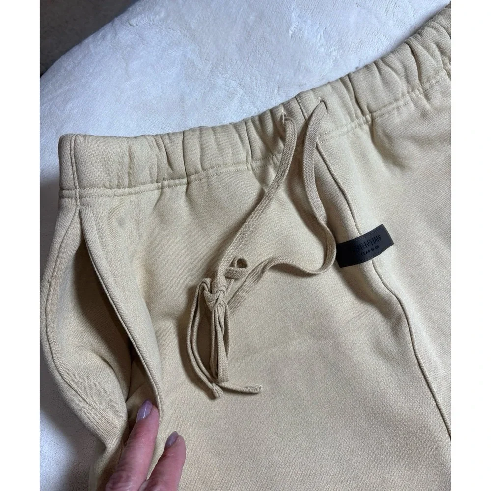 Men's medium Fear of God Essentials baggy sand colored sweat shorts. NEW.